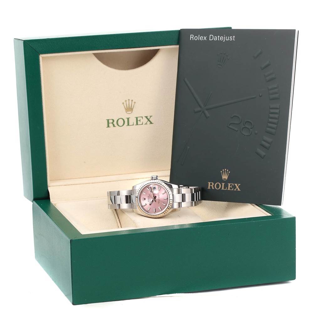 The image shows the Rolex Datejust 179174 Women's Stainless Steel Pink Dial 179174 Women's Stainless Steel Pink Dial watch in its box with a booklet beside it.