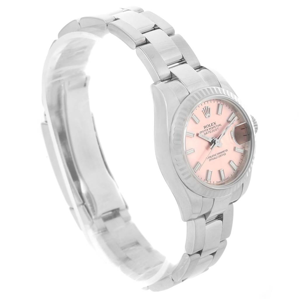 The Rolex Datejust 179174 Women's Stainless Steel Pink Dial 179174 Women's Stainless Steel Pink Dial watch is shown from an angled side view, including the dial, bezel, and part of the bracelet.