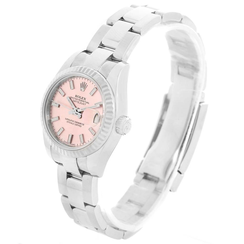 The image shows a Rolex Datejust 179174 Women's Stainless Steel Pink Dial 179174 Women's Stainless Steel Pink Dial watch from a left side angle, highlighting its pink dial, fluted bezel, and metal bracelet.