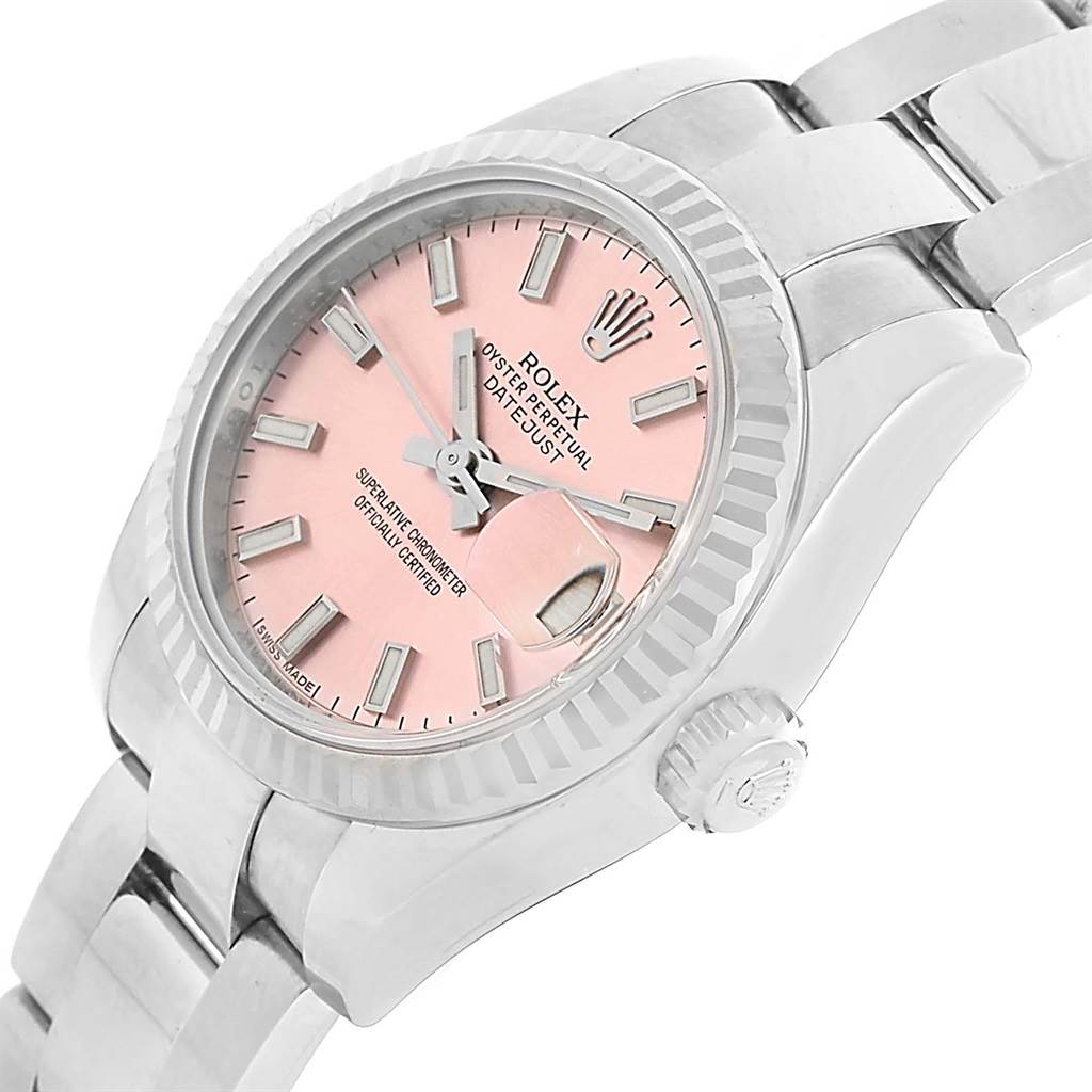 This image shows a Rolex Datejust 179174 Women's Stainless Steel Pink Dial 179174 Women's Stainless Steel Pink Dial watch at a slight side angle, highlighting its pink dial, fluted bezel, and oyster bracelet.