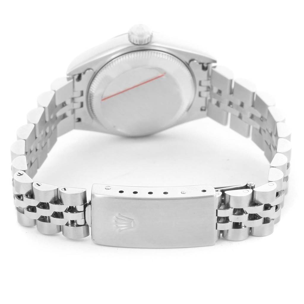 The image shows the back of a Rolex Datejust 79174 Women
s Stainless Steel Silver Dial 79174 Women
s Stainless Steel Silver Dial watch highlighting the case back and the bracelet clasp.