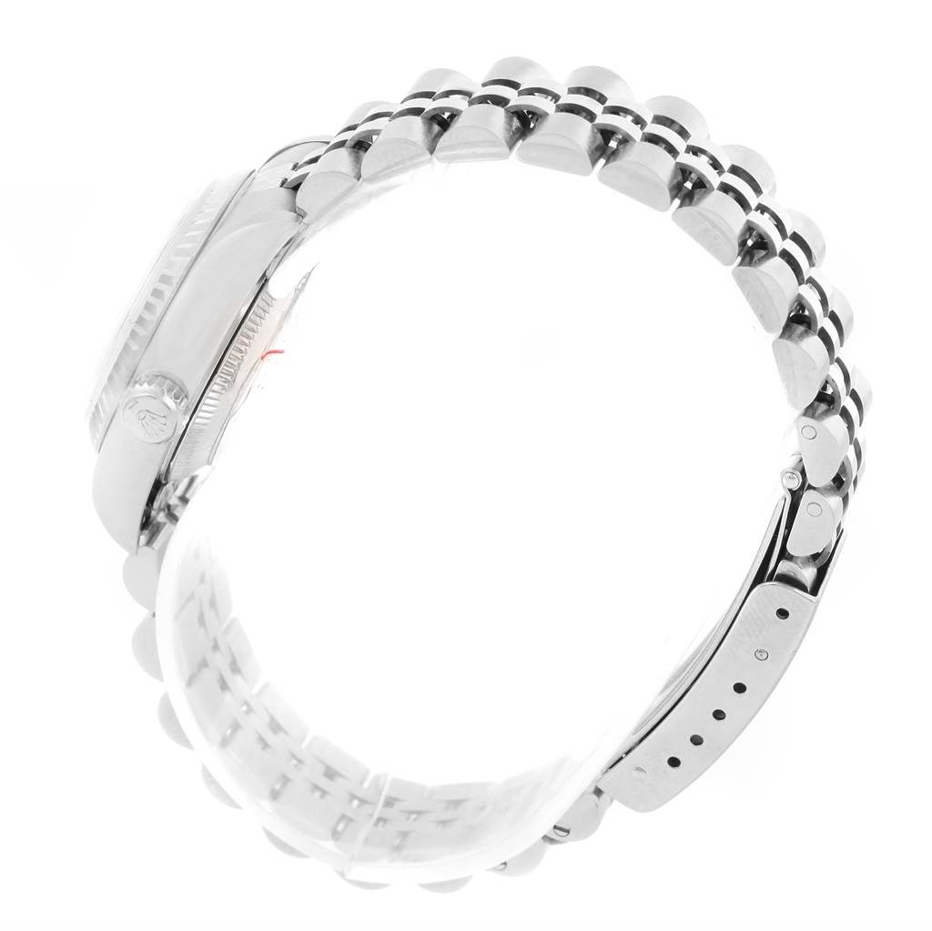 This side view of the Rolex Datejust 79174 Women
s Stainless Steel Silver Dial 79174 Women
s Stainless Steel Silver Dial watch highlights the case, crown, and Jubilee bracelet.