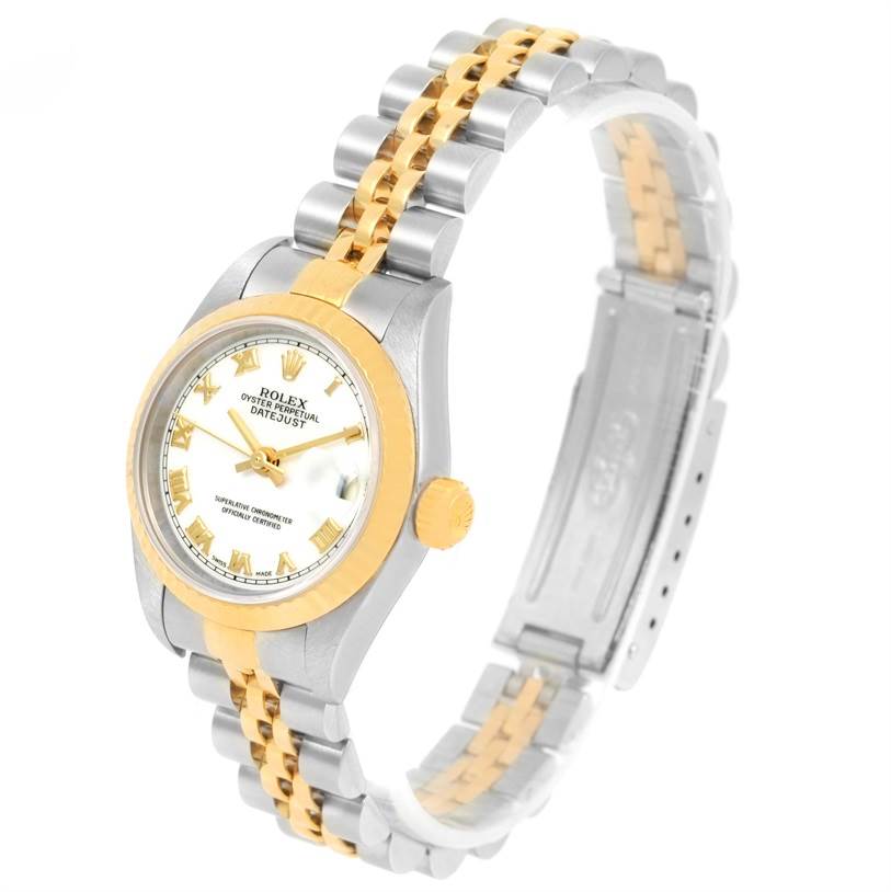 The image shows a Rolex Datejust 79173 Women
s Stainless Steel White Dial 79173 Women
s Stainless Steel White Dial watch at a three-quarter angle, displaying the face, bezel, crown, and two-tone bracelet.