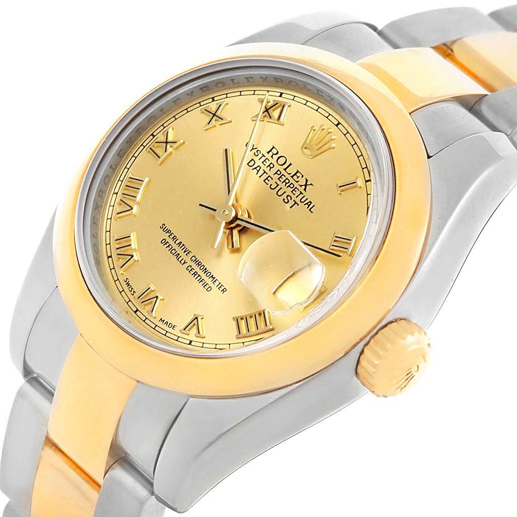 The Rolex Datejust 179163 Women's Steel and Gold (two tone) Champagne Dial 179163 Women's Steel and Gold (two tone) Champagne Dial watch is shown from a slight angle, highlighting its gold dial, bezel, crown, and two-tone bracelet.