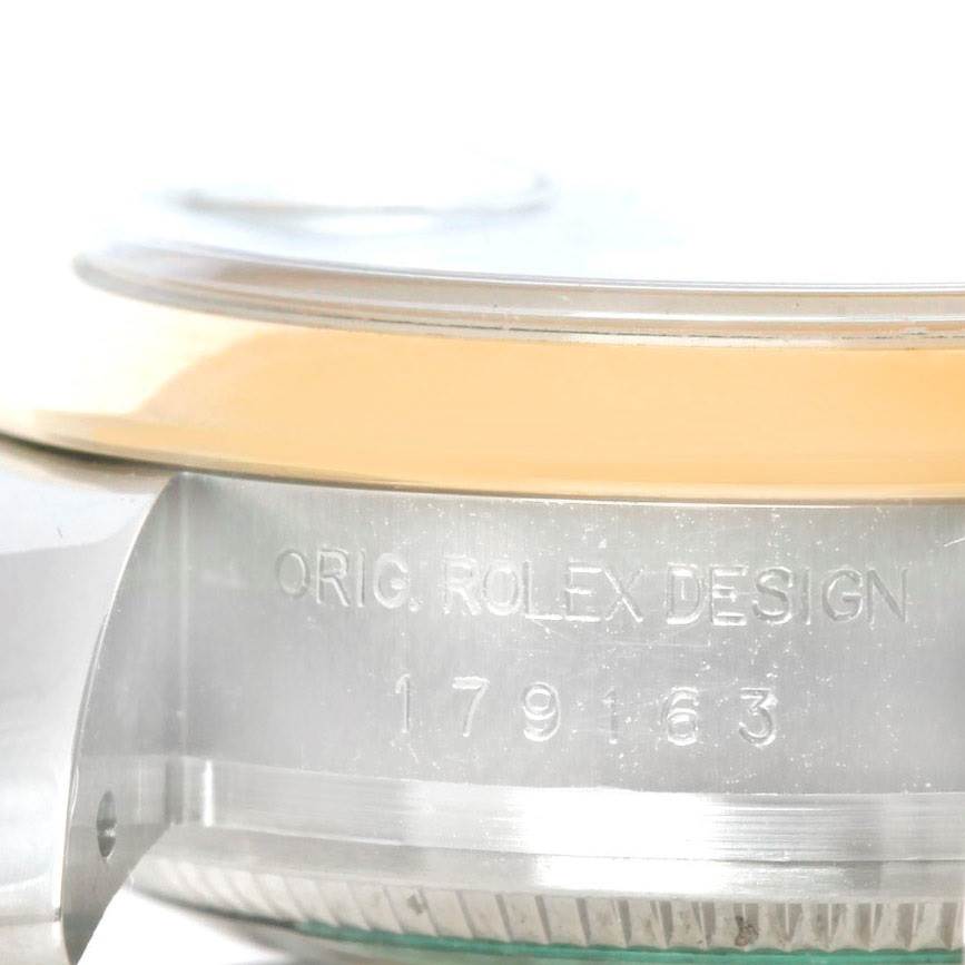 The image shows a close-up side view of a Rolex Datejust 179163 Women's Steel and Gold (two tone) Champagne Dial 179163 Women's Steel and Gold (two tone) Champagne Dial watch, highlighting the model number and "ORIG. ROLEX DESIGN" engraving.