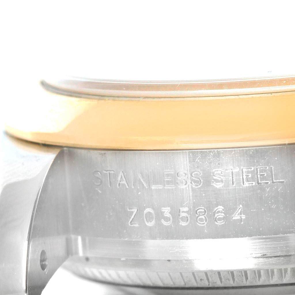 The image shows a close-up of the side of a Rolex Datejust 179163 Women's Steel and Gold (two tone) Champagne Dial 179163 Women's Steel and Gold (two tone) Champagne Dial watch, highlighting the serial number and stainless steel case.