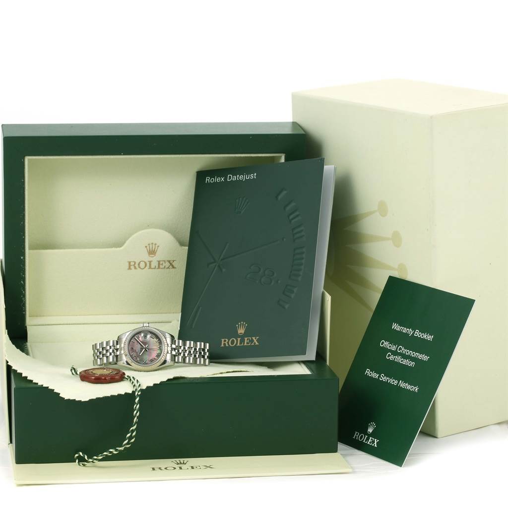 The Rolex Datejust 179174 Women
s Stainless Steel Mother of Pearl Dial 179174 Women
s Stainless Steel Mother of Pearl Dial watch is shown in its open case, accompanied by booklets and a warranty card. 
