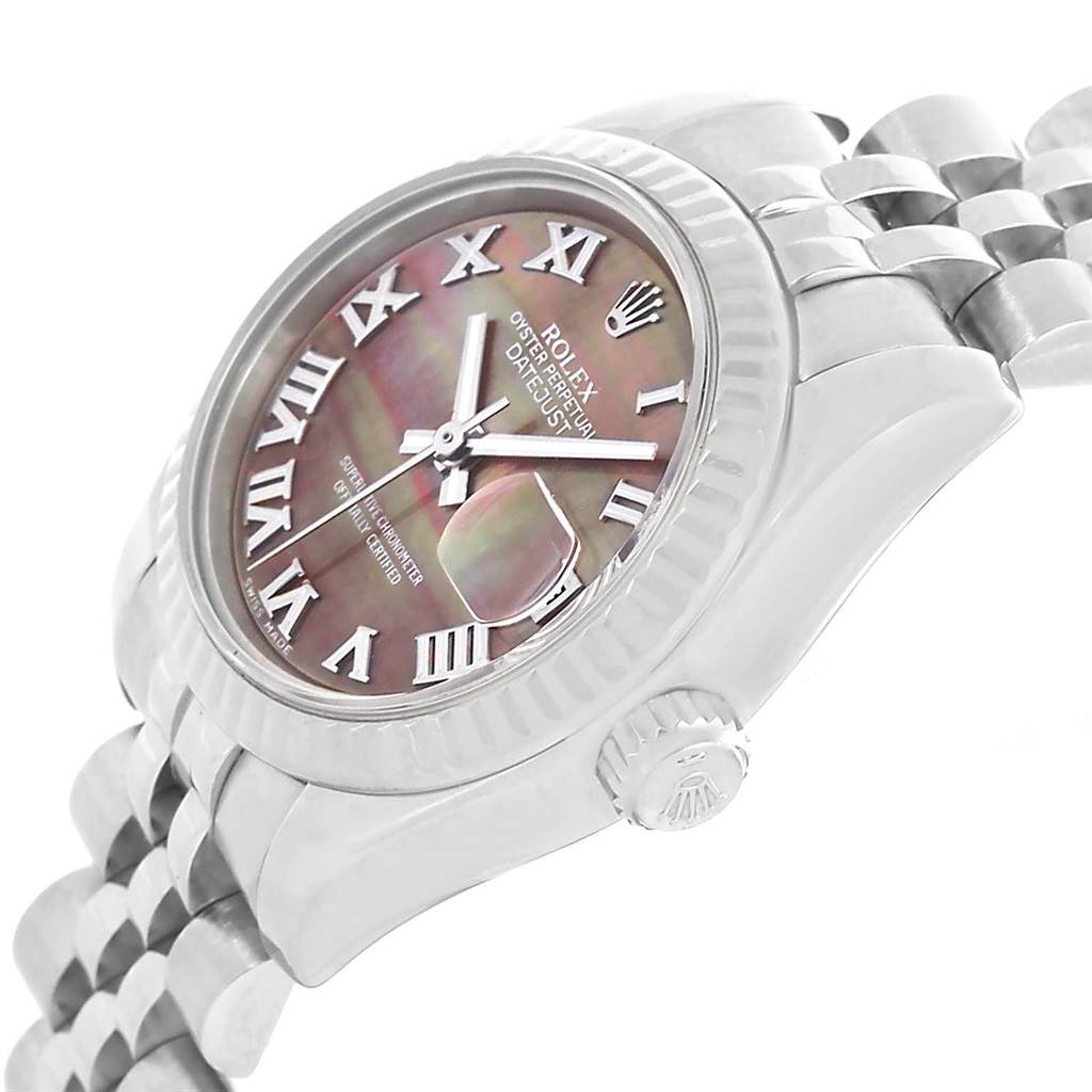 This image shows a Rolex Datejust 179174 Women
s Stainless Steel Mother of Pearl Dial 179174 Women
s Stainless Steel Mother of Pearl Dial watch at an angle highlighting its face, bezel, crown, and part of the bracelet.