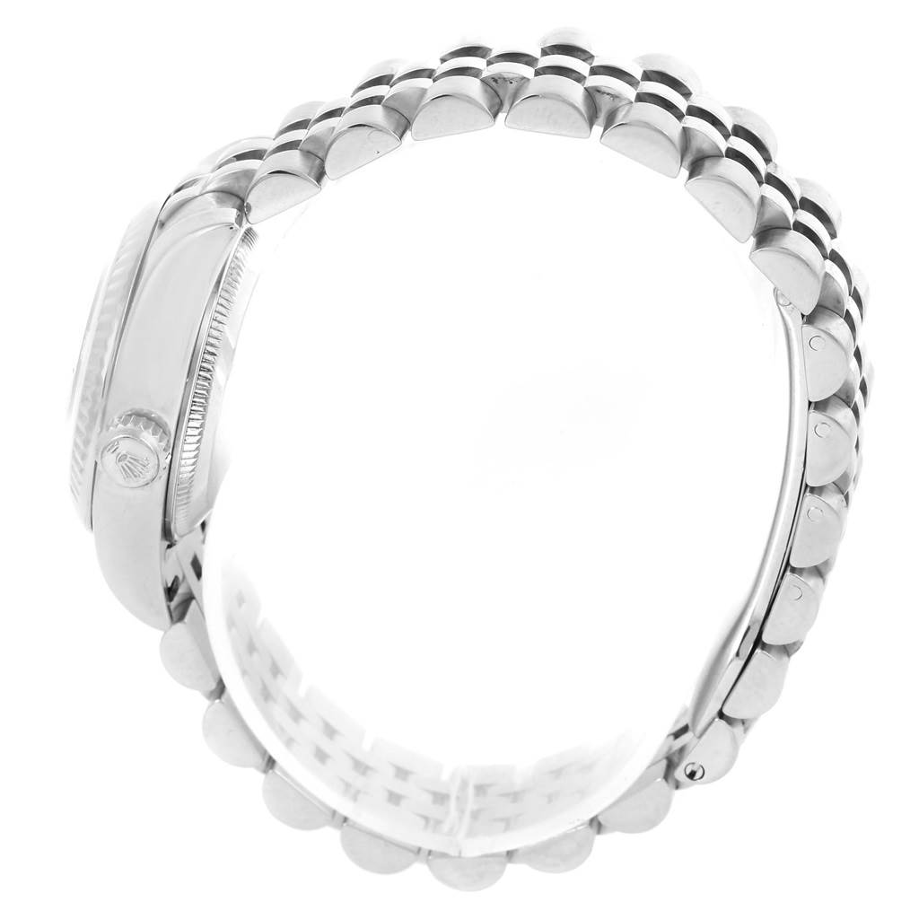 The image shows a side view of a Rolex Datejust 179174 Women
s Stainless Steel Mother of Pearl Dial 179174 Women
s Stainless Steel Mother of Pearl Dial watch, displaying its case side, winding crown, and a section of the bracelet.