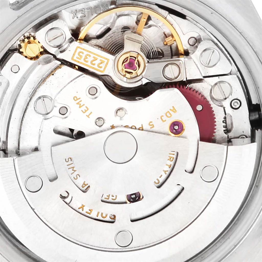 This is a close-up view of the Rolex Datejust 179174 Women's Stainless Steel Black Dial 179174 Women's Stainless Steel Black Dial watch showing its internal mechanical movement and rotor.