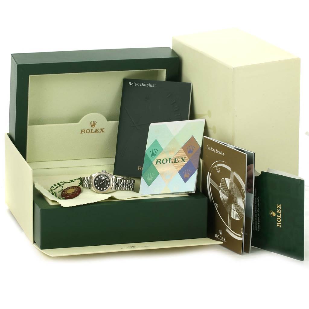 The image shows a Rolex Datejust 179174 Women's Stainless Steel Black Dial 179174 Women's Stainless Steel Black Dial watch in its original box with accompanying booklets and tags from a frontal angle.