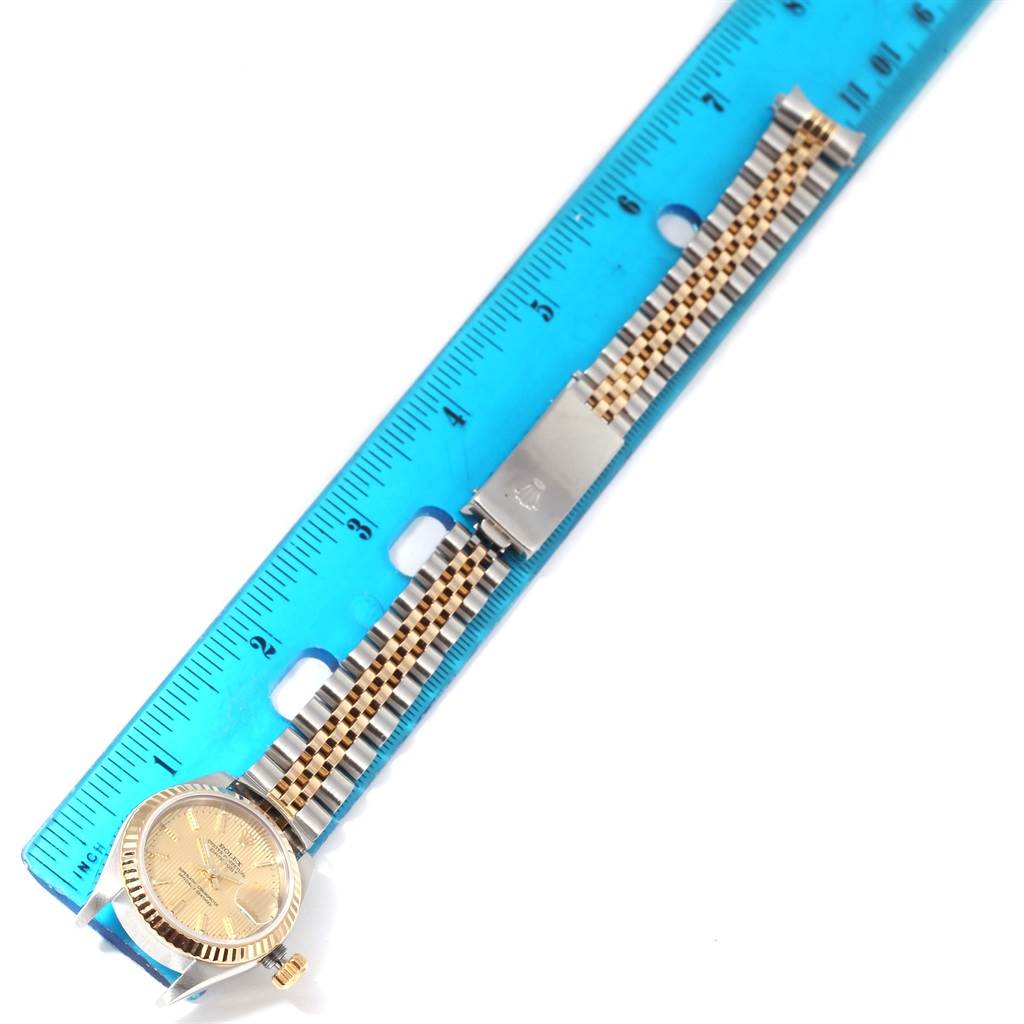 This top-view image shows the Rolex Datejust 79173 Women
s Stainless Steel Champagne Dial 79173 Women
s Stainless Steel Champagne Dial watch with its face, bezel, bracelet, and clasp.