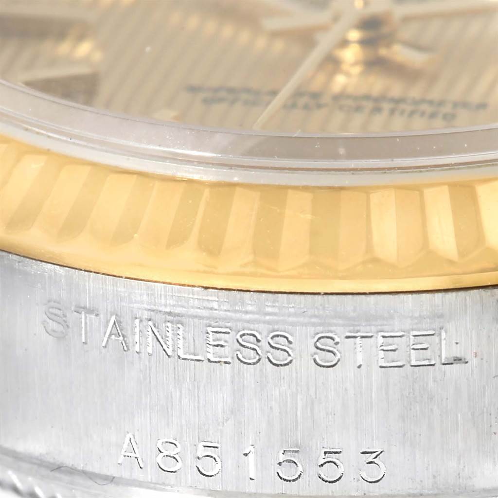 The image shows a close-up of the bezel and the case side of a Rolex Datejust 79173 Women
s Stainless Steel Champagne Dial 79173 Women
s Stainless Steel Champagne Dial watch, displaying "STAINLESS STEEL."