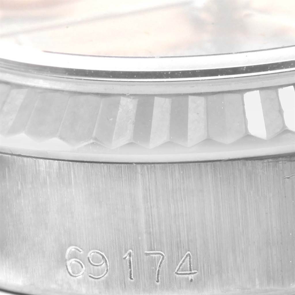 The image shows a close-up of the bezel and part of the case with the model number of a Rolex Datejust 69174 Women's Stainless Steel Pink Dial 69174 Women's Stainless Steel Pink Dial watch.