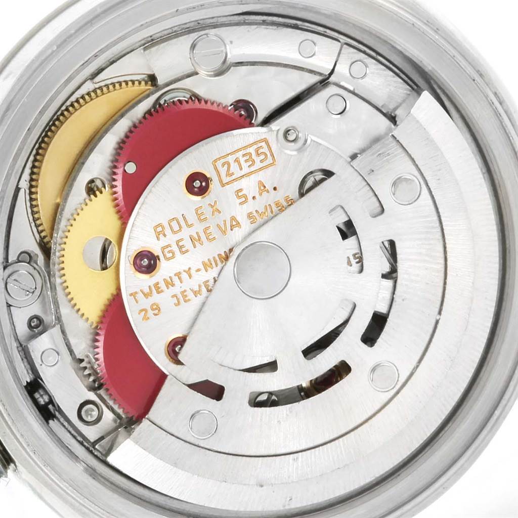 This image shows a close-up view of the movement mechanism of a Rolex Datejust 69174 Women's Stainless Steel Pink Dial 69174 Women's Stainless Steel Pink Dial watch, model 2135.