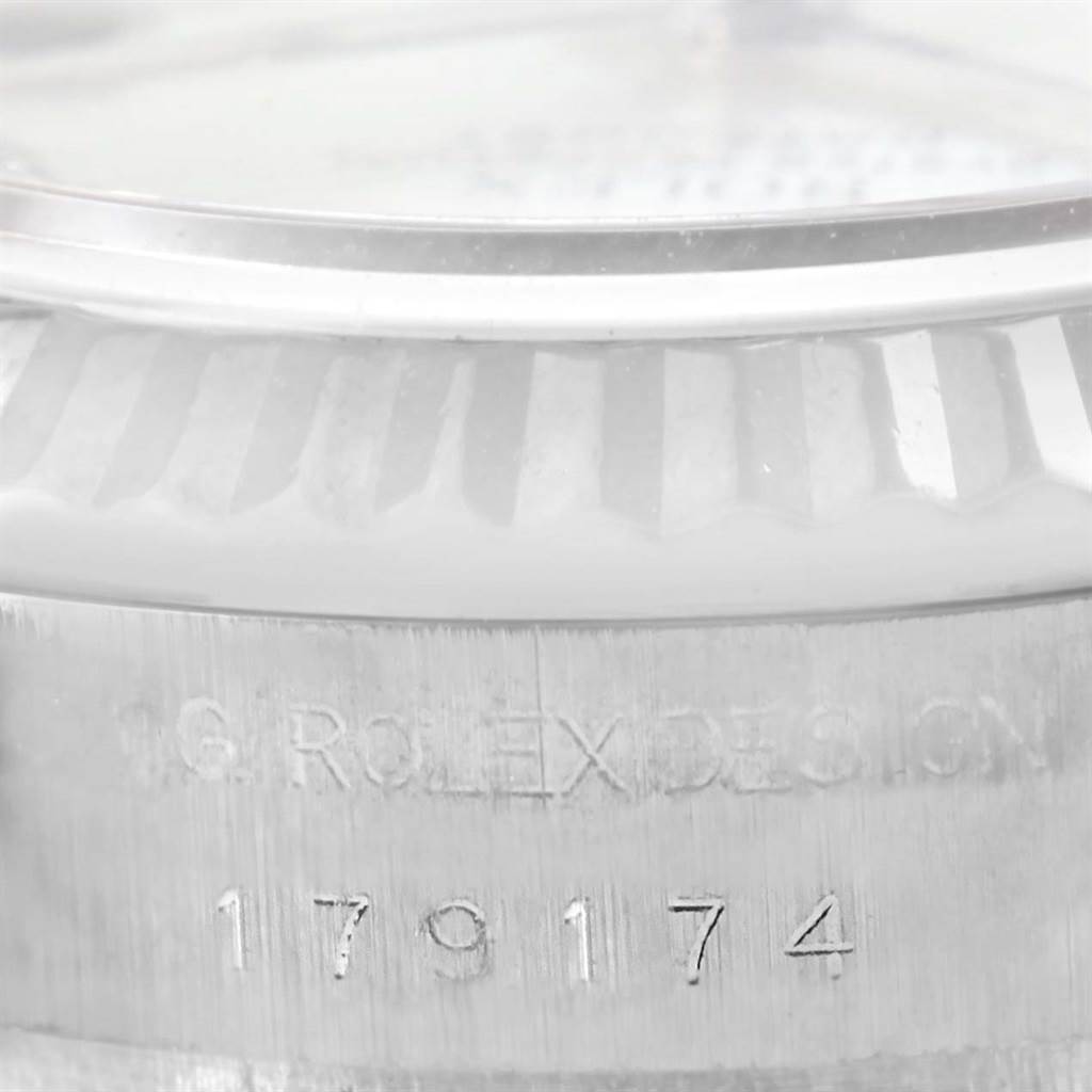 This image shows a close-up of the side of a Rolex Datejust 179174 Women
s Stainless Steel Mother of Pearl Dial 179174 Women
s Stainless Steel Mother of Pearl Dial watch, highlighting the model number and the engraved "R.O.L.E.X." text.
