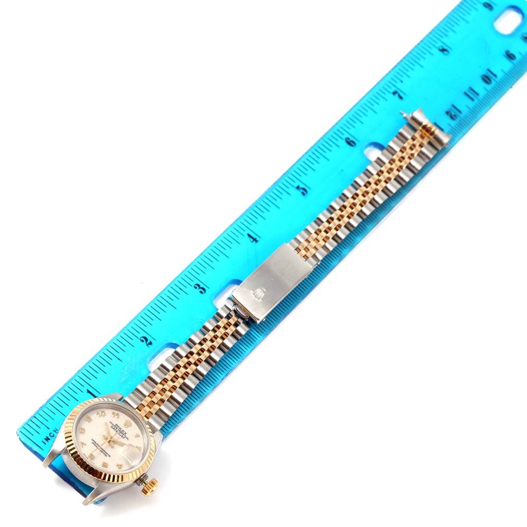 The image shows a Rolex Datejust 69173 Women's Stainless Steel Beige Dial 69173 Women's Stainless Steel Beige Dial watch laid flat next to a ruler, highlighting its bracelet and clasp.