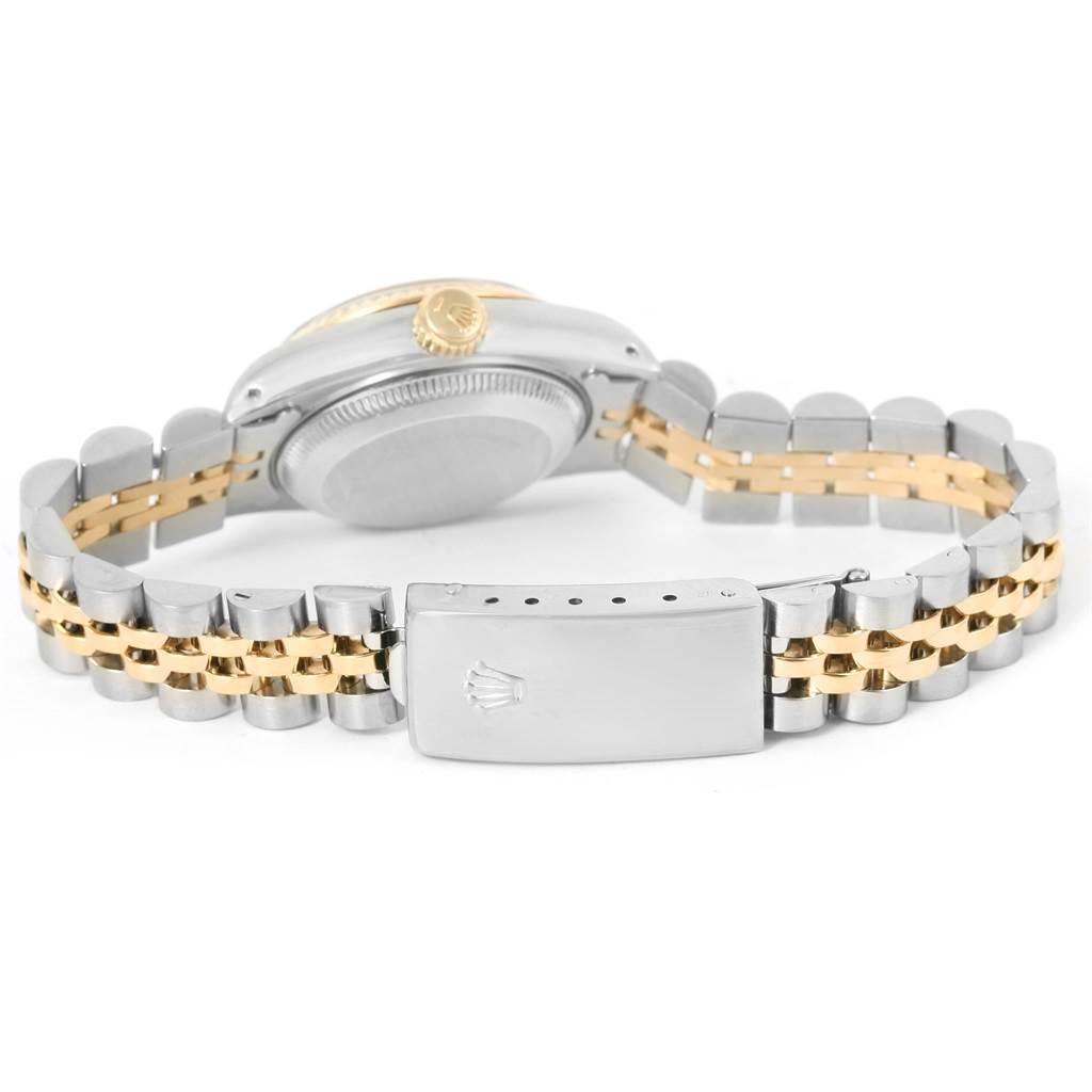 This image shows the back of a Rolex Datejust 69173 Women's Stainless Steel Beige Dial 69173 Women's Stainless Steel Beige Dial watch, highlighting the casing, crown, and two-tone bracelet with the clasp.