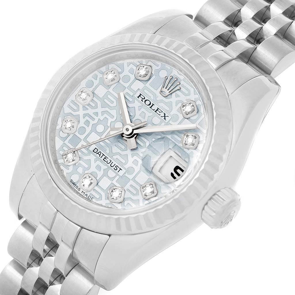 The image shows a close-up of the Rolex Datejust 179174 Women's Stainless Steel Blue Dial 179174 Women's Stainless Steel Blue Dial watch's face, bezel, crown, and part of its bracelet.