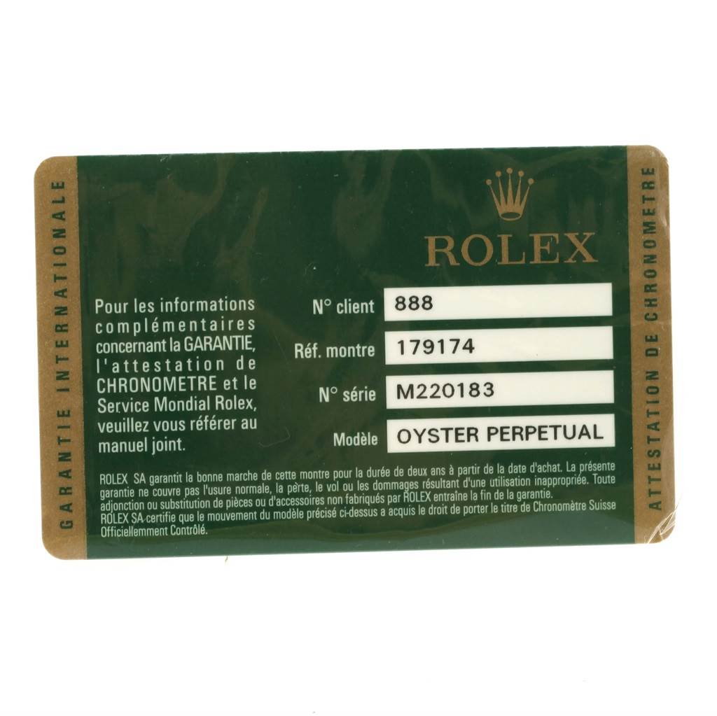 This image shows a Rolex Datejust 179174 Women's Stainless Steel Blue Dial 179174 Women's Stainless Steel Blue Dial warranty card with details like the serial number and model information.