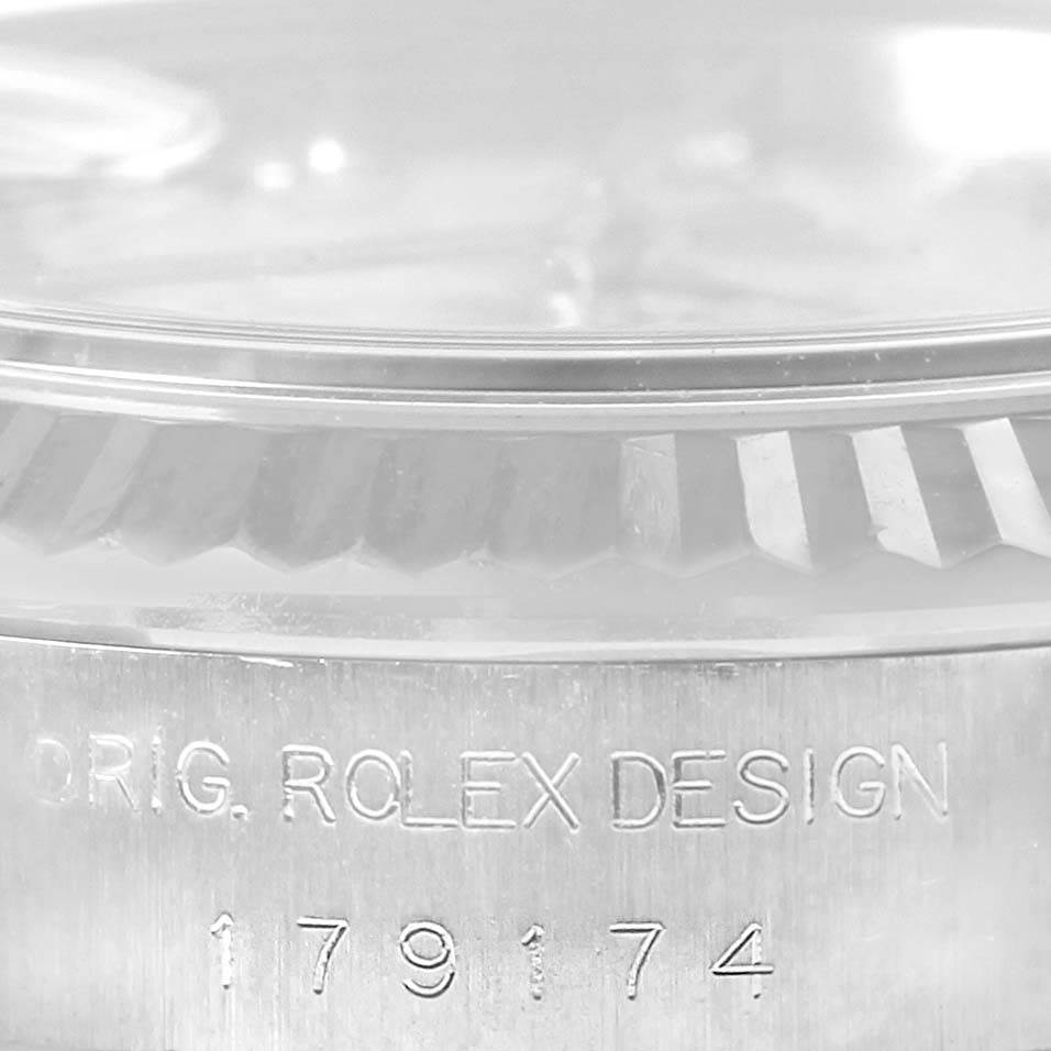This image shows a close-up of the serial number and part of the bezel on a Rolex Datejust 179174 Women's Stainless Steel Blue Dial 179174 Women's Stainless Steel Blue Dial watch.