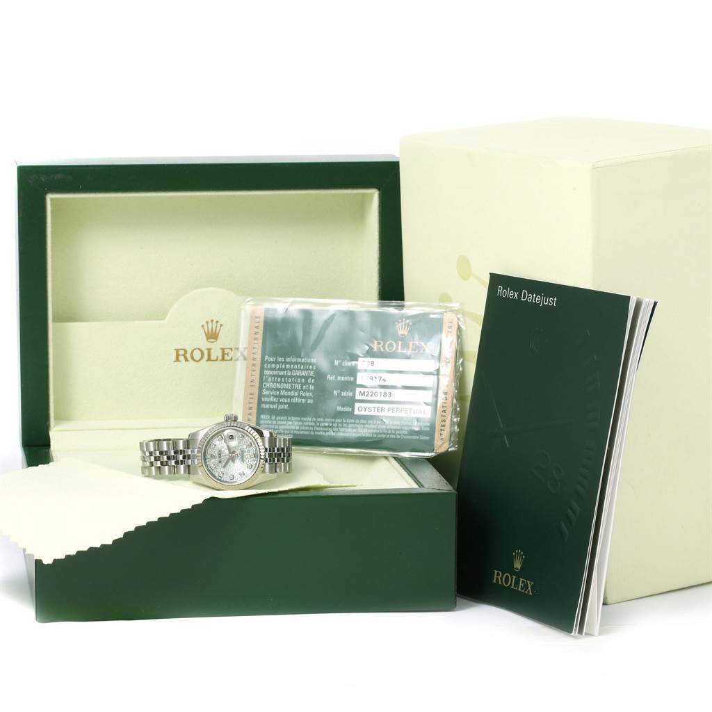 The image shows a Rolex Datejust 179174 Women's Stainless Steel Blue Dial 179174 Women's Stainless Steel Blue Dial watch, its box, warranty card, and an instruction manual.
