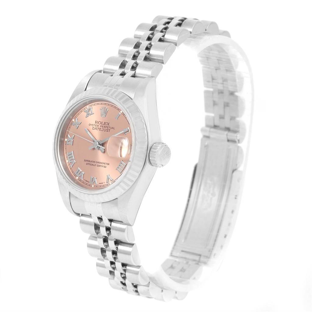 This Rolex Datejust 69174 Women
s Stainless Steel Pink Dial 69174 Women
s Stainless Steel Pink Dial watch is shown from an angle highlighting its face, crown, and bracelet.