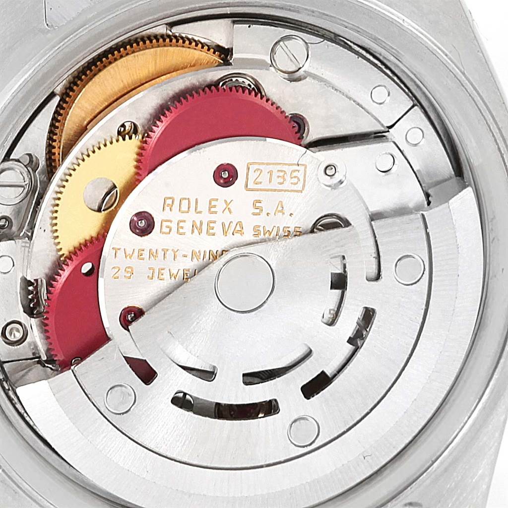 The image shows the internal mechanism of a Rolex Datejust 69173 Women's Stainless Steel Champagne Dial 69173 Women's Stainless Steel Champagne Dial watch, displaying gears and parts from a top-down angle.