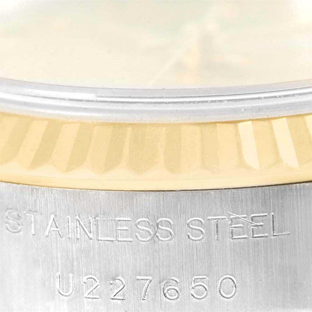 This close-up image shows the bezel and part of the case of a Rolex Datejust 69173 Women's Stainless Steel Champagne Dial 69173 Women's Stainless Steel Champagne Dial watch.