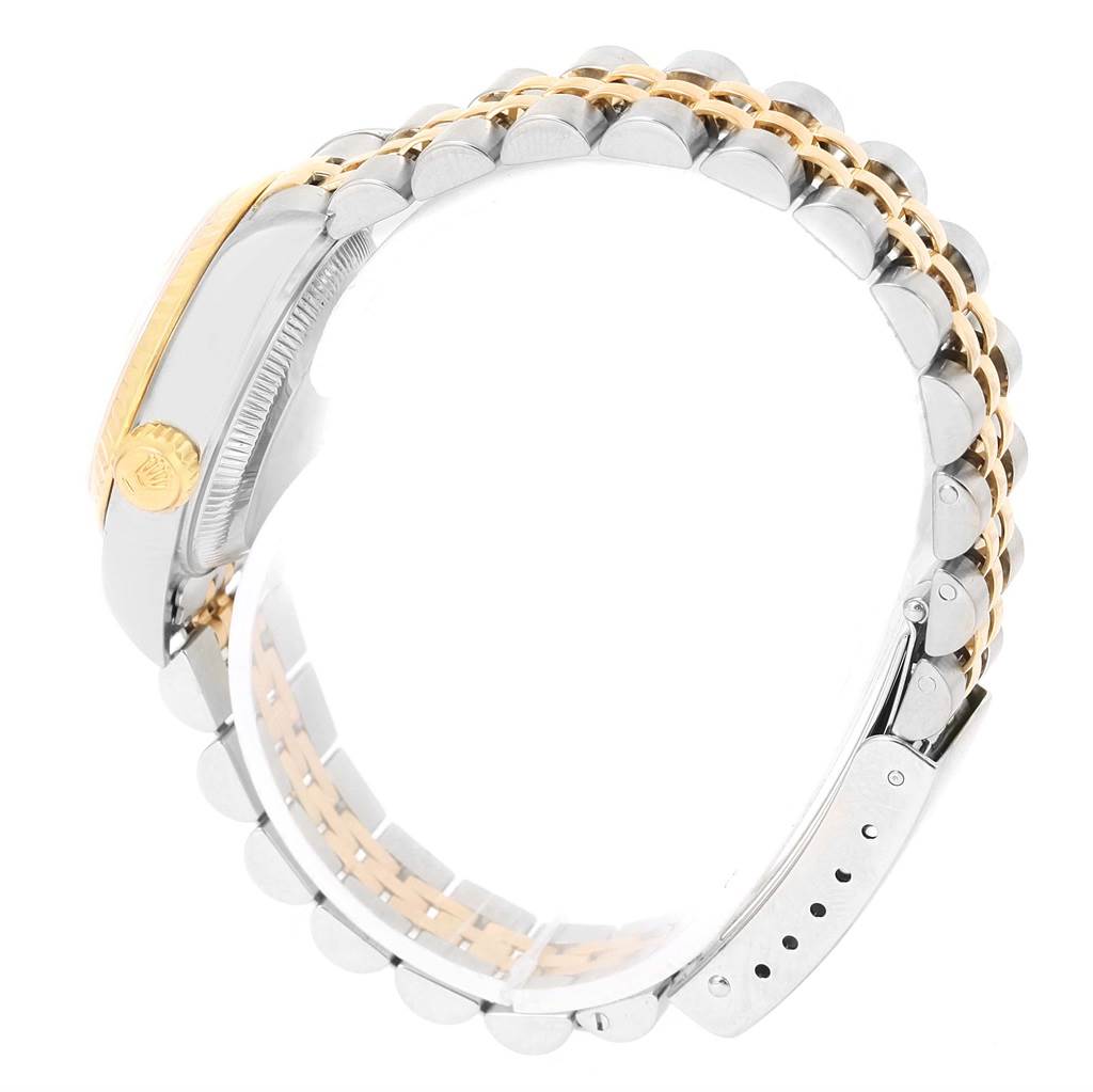 The image shows a side view of the Rolex Datejust 69173 Women's Stainless Steel Champagne Dial 69173 Women's Stainless Steel Champagne Dial watch with its stainless steel and gold Jubilee bracelet.