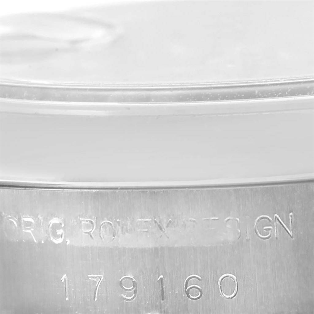 This image shows a close-up of the serial number engraving on the side of a Rolex Datejust 179160 Women's Stainless Steel Pink Dial 179160 Women's Stainless Steel Pink Dial model's case.