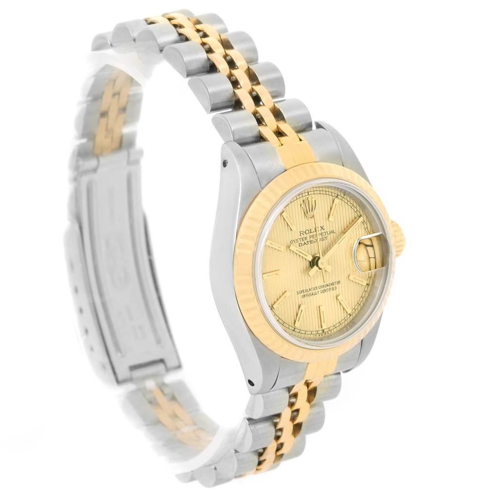 This is a Rolex Datejust 69173 Women
s Stainless Steel Champagne Dial 69173 Women
s Stainless Steel Champagne Dial watch shown from a side angle, highlighting the two-tone metal bracelet, bezel, and face.