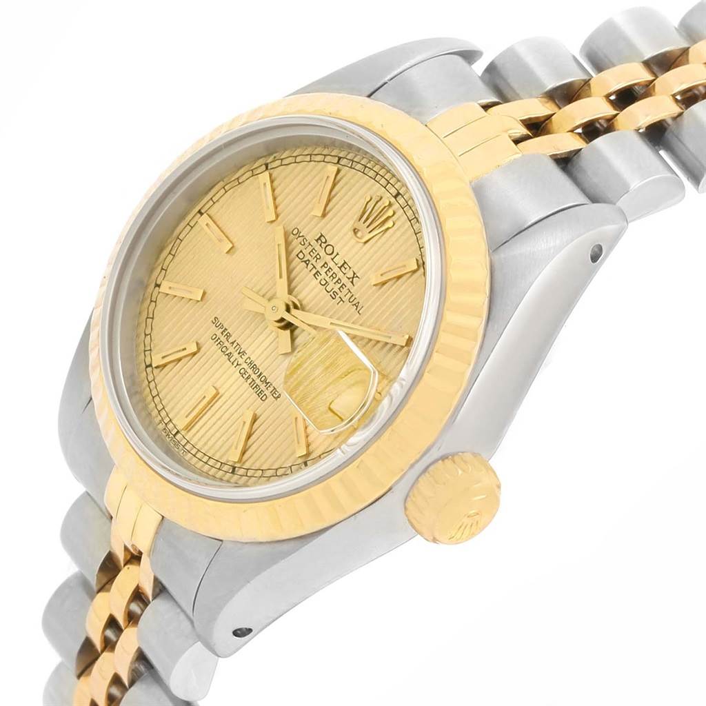 This Rolex Datejust 69173 Women
s Stainless Steel Champagne Dial 69173 Women
s Stainless Steel Champagne Dial watch is shown at an oblique angle, highlighting its bezel, crown, and part of the bracelet.