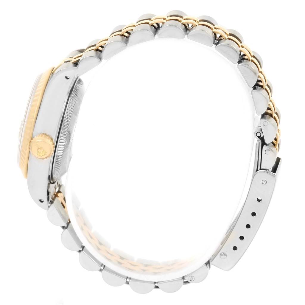 The image shows a side view of a Rolex Datejust 69173 Women
s Stainless Steel Champagne Dial 69173 Women
s Stainless Steel Champagne Dial watch, focusing on the bracelet and the crown.