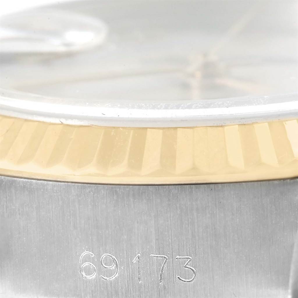 This image shows a detailed close-up of the side of a Rolex Datejust 69173 Women's Stainless Steel Champagne Dial 69173 Women's Stainless Steel Champagne Dial watch bezel with model number 69173 engraved.
