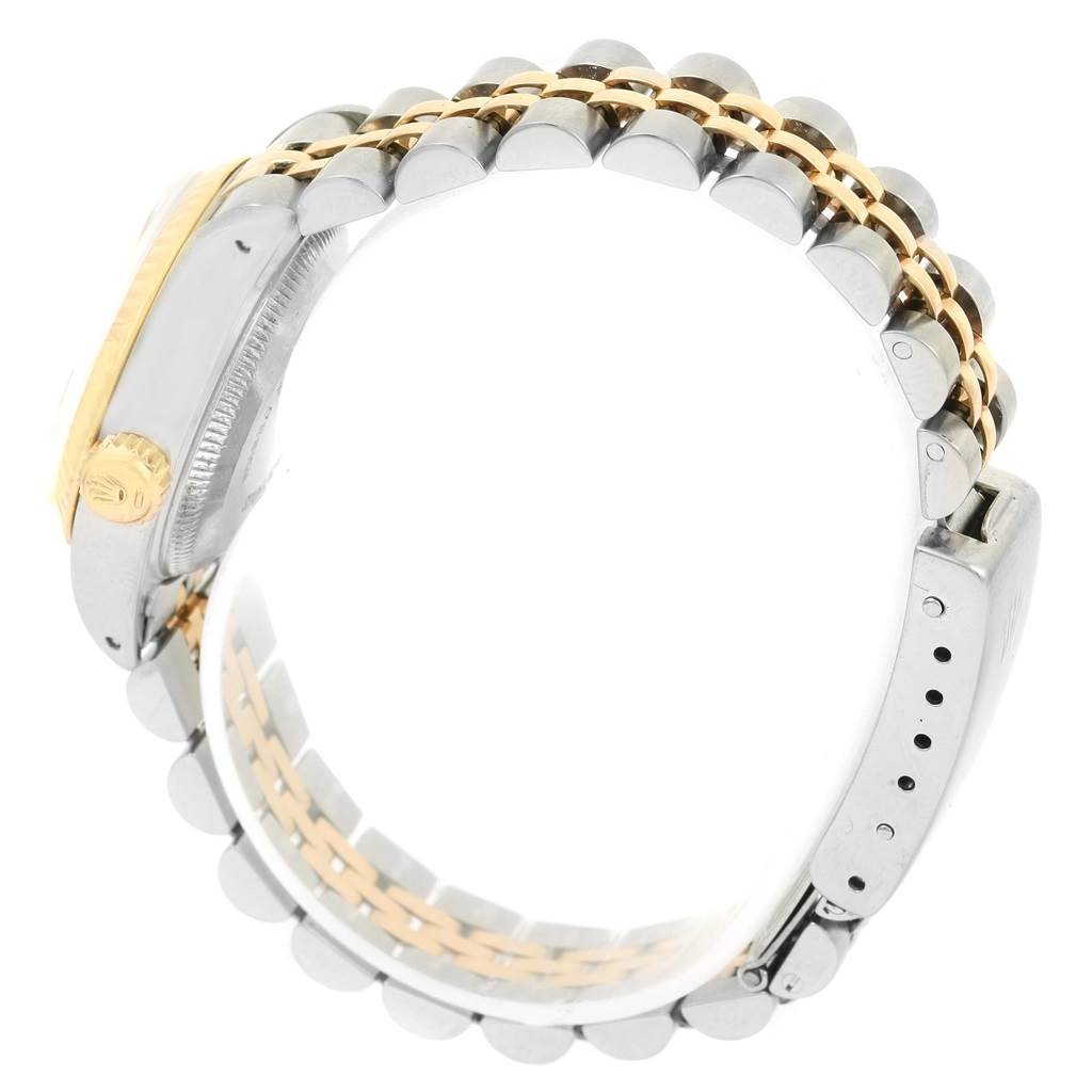 The image shows the side view of a Rolex Datejust 69173 Women's Stainless Steel Champagne Dial 69173 Women's Stainless Steel Champagne Dial watch, highlighting its crown and two-tone bracelet.