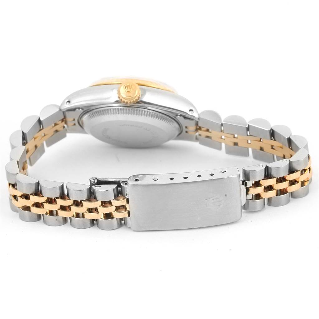 The image shows the side and back of the Rolex Datejust 69173 Women's Stainless Steel Champagne Dial 69173 Women's Stainless Steel Champagne Dial watch with a view of its two-tone bracelet and clasp.