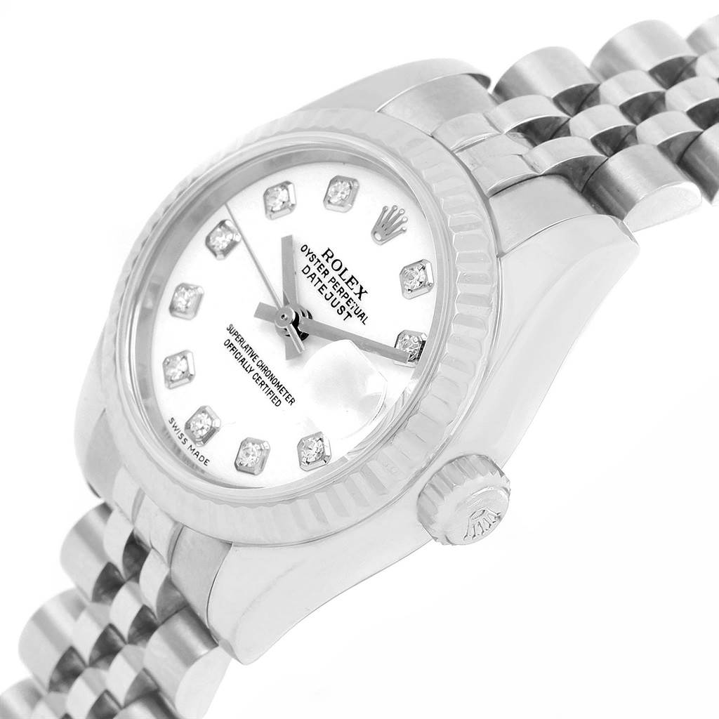 The image shows a tilted close-up of the Rolex Datejust 179174 Women
s Stainless Steel White Dial 179174 Women
s Stainless Steel White Dial watch, focusing on the dial, bezel, crown, and part of the bracelet.