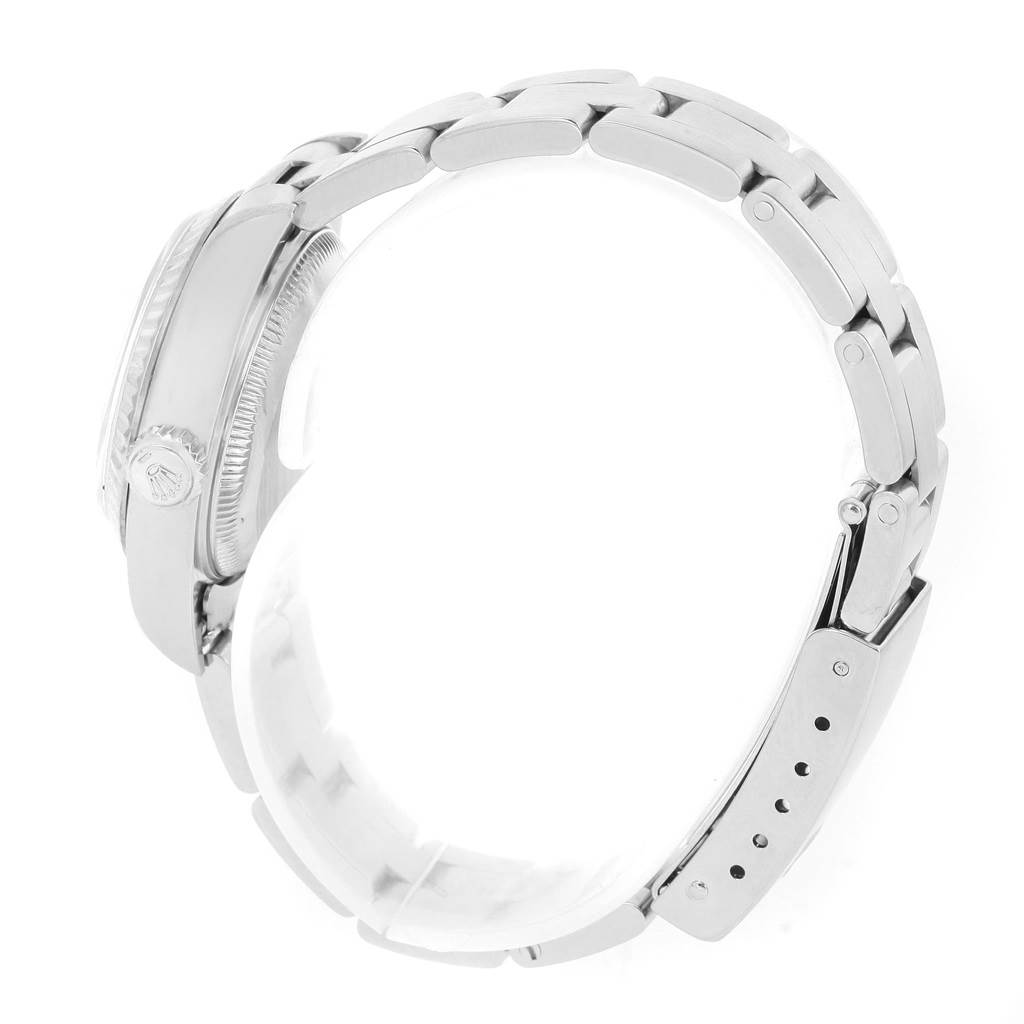 The image shows a side view of a Rolex Datejust 79174 Women's Stainless Steel Mother of Pearl Dial 79174 Women's Stainless Steel Mother of Pearl Dial watch, featuring its bracelet, clasp, and part of the case with the crown.