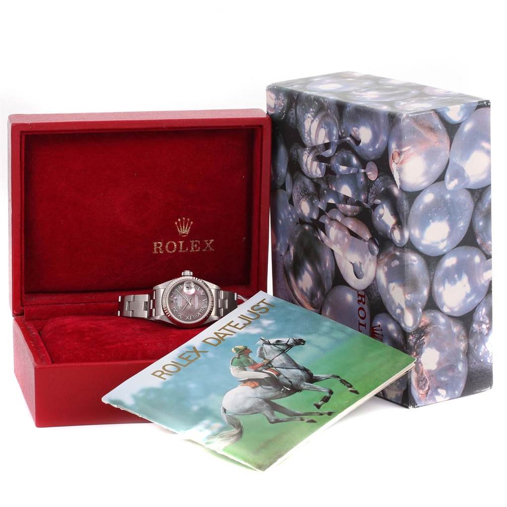 The image shows a Rolex Datejust 79174 Women's Stainless Steel Mother of Pearl Dial 79174 Women's Stainless Steel Mother of Pearl Dial watch placed in a red Rolex box, accompanied by a printed brochure and an outer sleeve packaging.