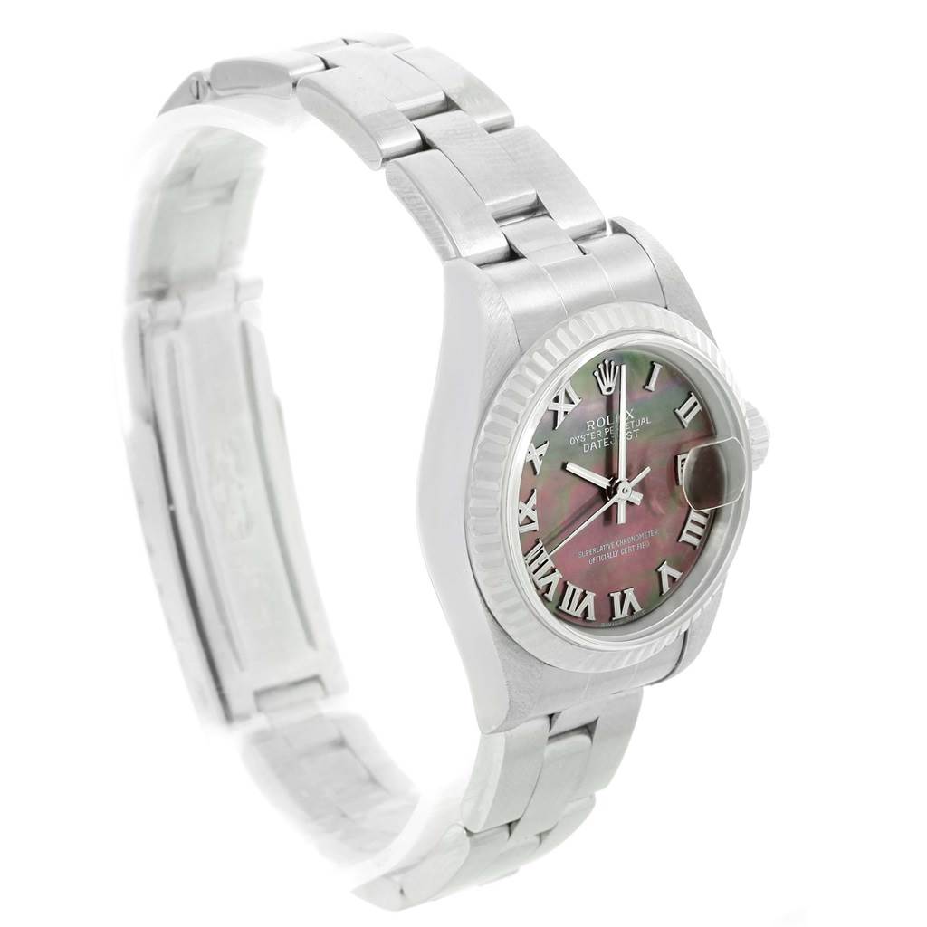 This image shows the Rolex Datejust 79174 Women's Stainless Steel Mother of Pearl Dial 79174 Women's Stainless Steel Mother of Pearl Dial watch from an angled side view, highlighting the dial, bezel, and partially open bracelet.