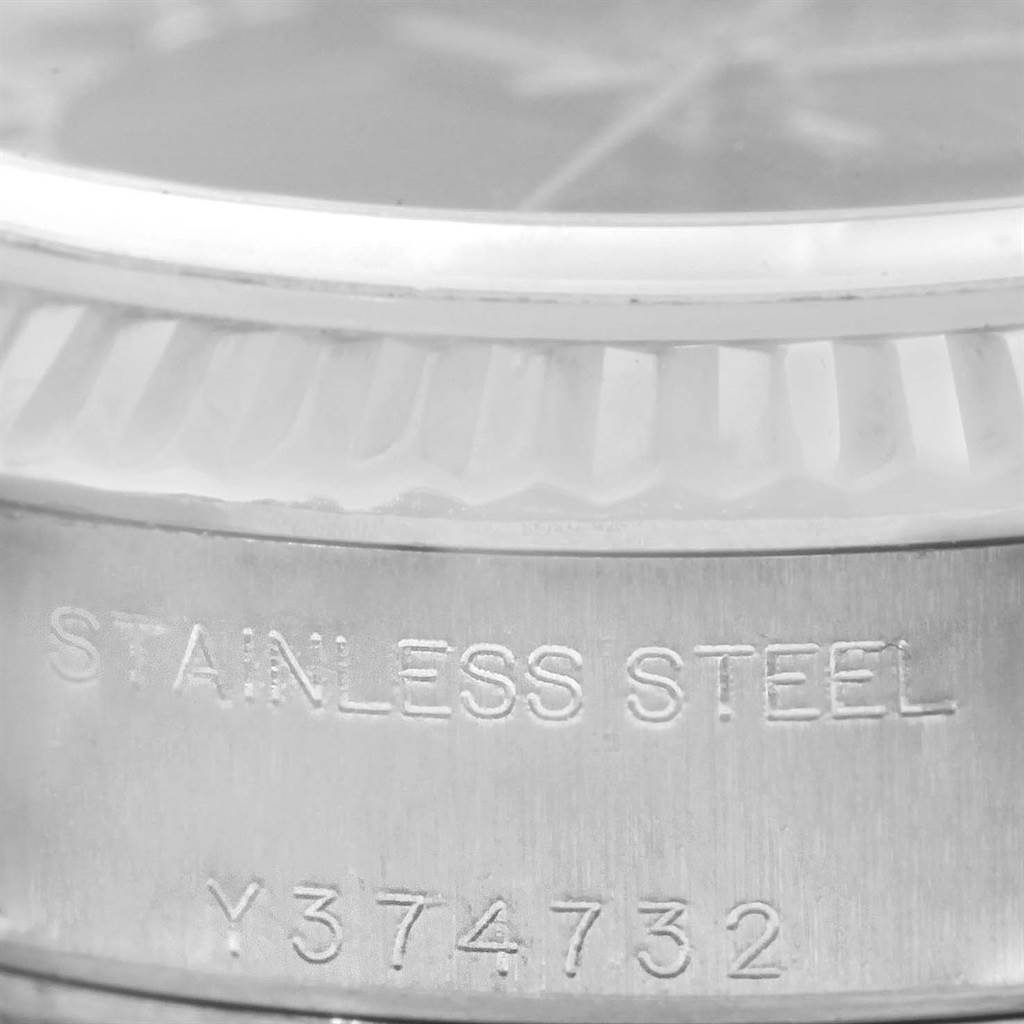 This close-up image shows the stainless steel case and etched serial number of a Rolex Datejust 79174 Women's Stainless Steel Mother of Pearl Dial 79174 Women's Stainless Steel Mother of Pearl Dial watch.
