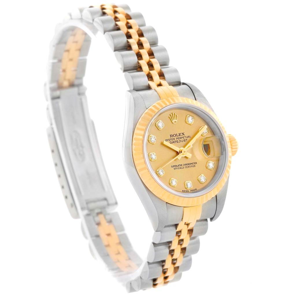 The Rolex Datejust 79163 Women's Steel and Gold (two tone) Champagne Dial 79163 Women's Steel and Gold (two tone) Champagne Dial watch is shown at an angled side view, highlighting the case, dial, bezel, and two-tone bracelet.