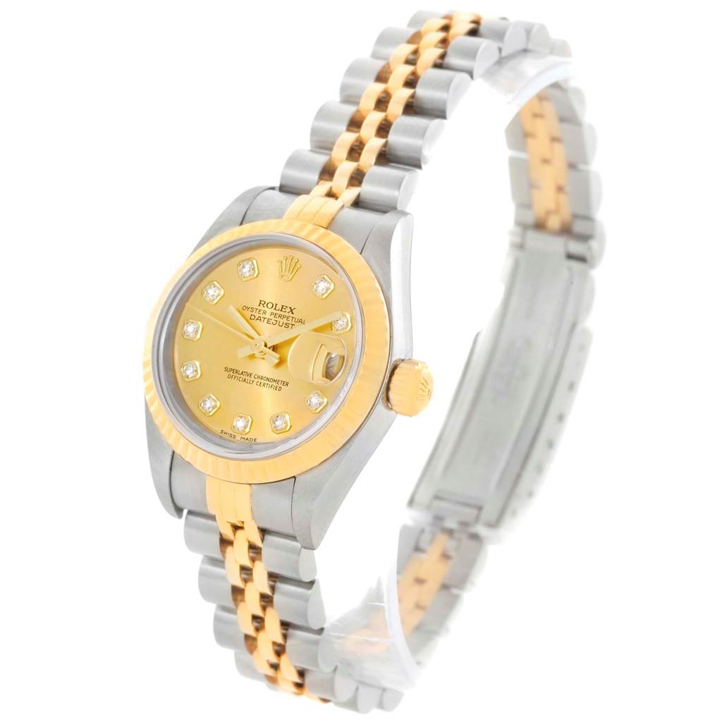 This image shows a Rolex Datejust 79163 Women's Steel and Gold (two tone) Champagne Dial 79163 Women's Steel and Gold (two tone) Champagne Dial watch at a three-quarter angle, highlighting its gold and silver bracelet, dial, and bezel.