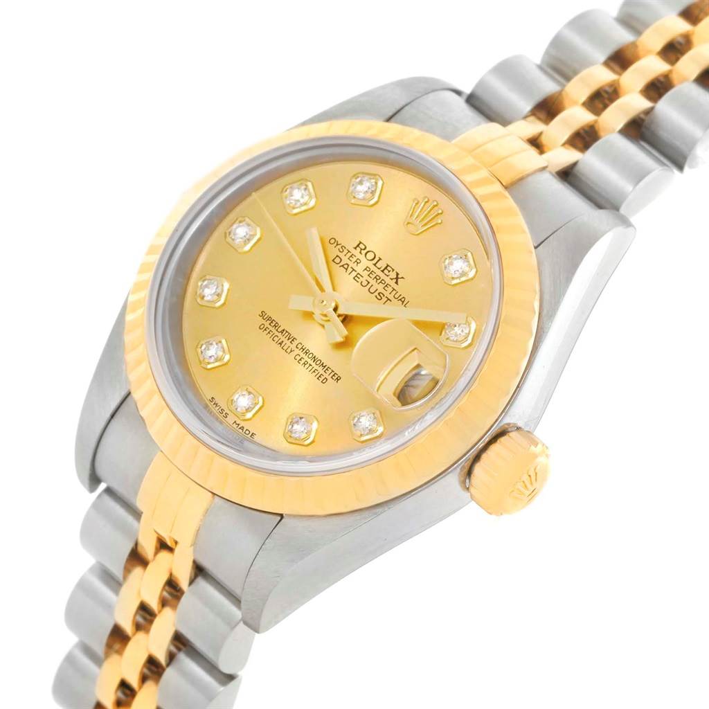 This image shows a close-up side angle of a Rolex Datejust 79163 Women's Steel and Gold (two tone) Champagne Dial 79163 Women's Steel and Gold (two tone) Champagne Dial watch, focusing on the dial, crown, and a portion of the jubilee bracelet.