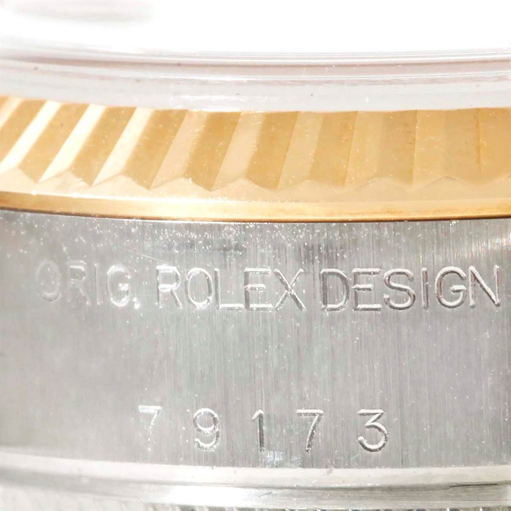 This close-up image shows the engraved bezel and model number of the Rolex Datejust 79163 Women's Steel and Gold (two tone) Champagne Dial 79163 Women's Steel and Gold (two tone) Champagne Dial.
