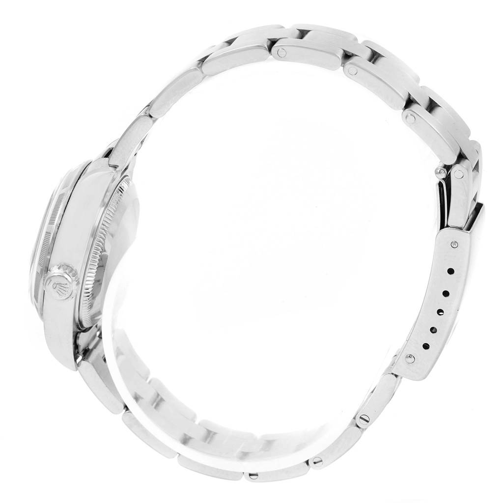 The image shows a side view of a Rolex Datejust 79190 Women's Stainless Steel Black Dial 79190 Women's Stainless Steel Black Dial watch, highlighting its bracelet, clasp, and case.