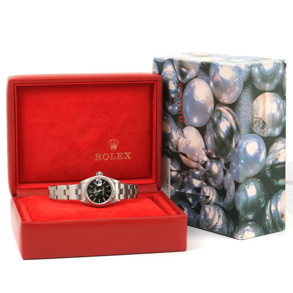 The Rolex Datejust 79190 Women's Stainless Steel Black Dial 79190 Women's Stainless Steel Black Dial watch is shown in its open red box, alongside its decorative outer packaging with a pearl-like design.