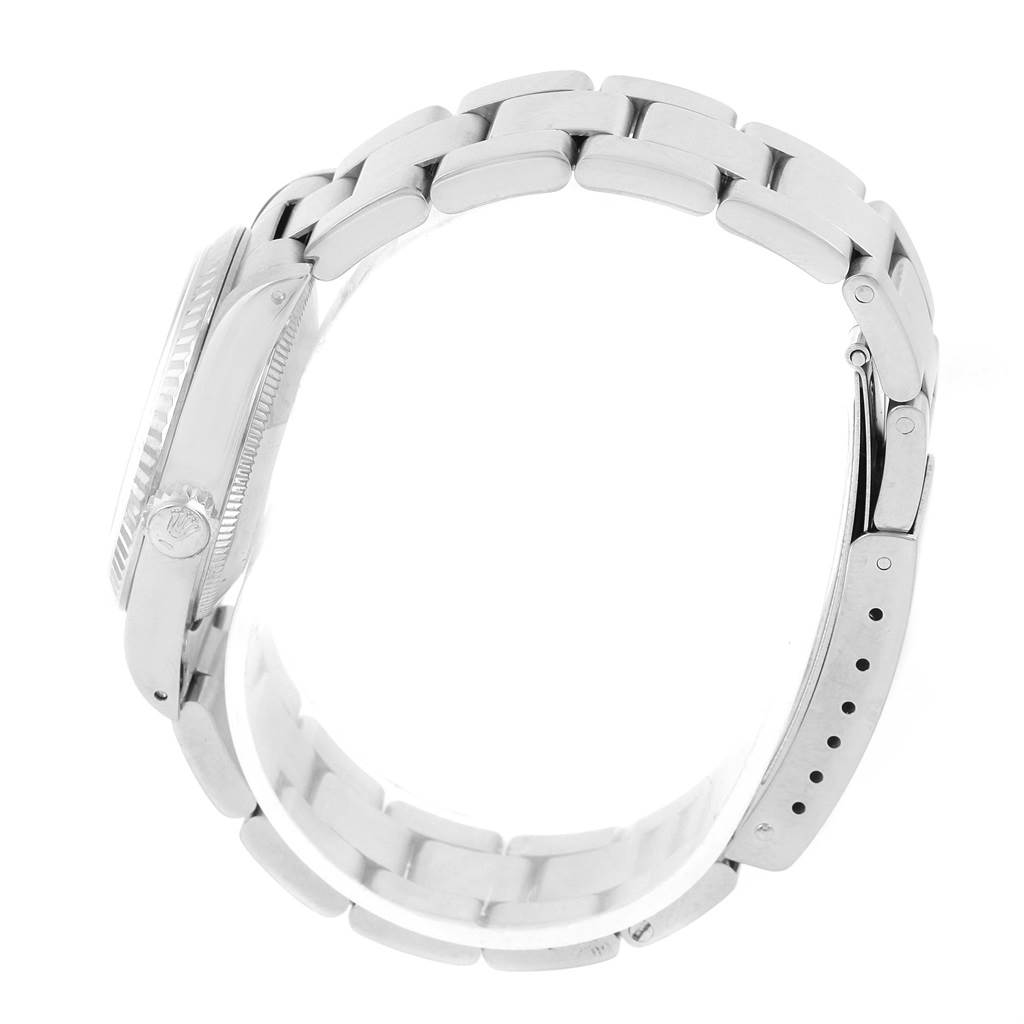 The image shows a side view of a Rolex Datejust 67514 Women's Stainless Steel White Dial 67514 Women's Stainless Steel White Dial watch, highlighting the case, crown, and bracelet with the clasp.