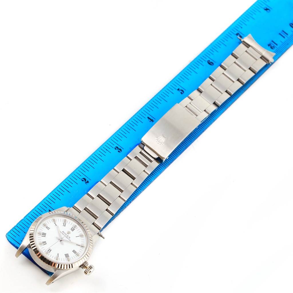 The image shows a Rolex Datejust 67514 Women's Stainless Steel White Dial 67514 Women's Stainless Steel White Dial watch laid flat, alongside a ruler to measure its length.